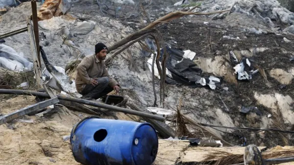 Israeli airstrikes frequently target Gaza. Here, a Palestinian man sits in the rubble of his home following a airstrike on the southern Gaza strip. (AFP/File)