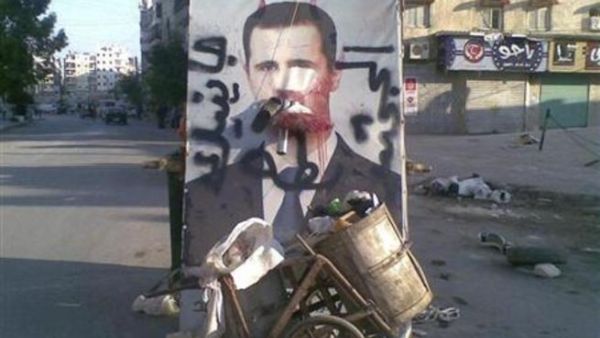 صورة مشوهة للرئيس السوري بشار الاسد في حلب صورة مشوهة للرئيس السوري بشار الاسد في حلب