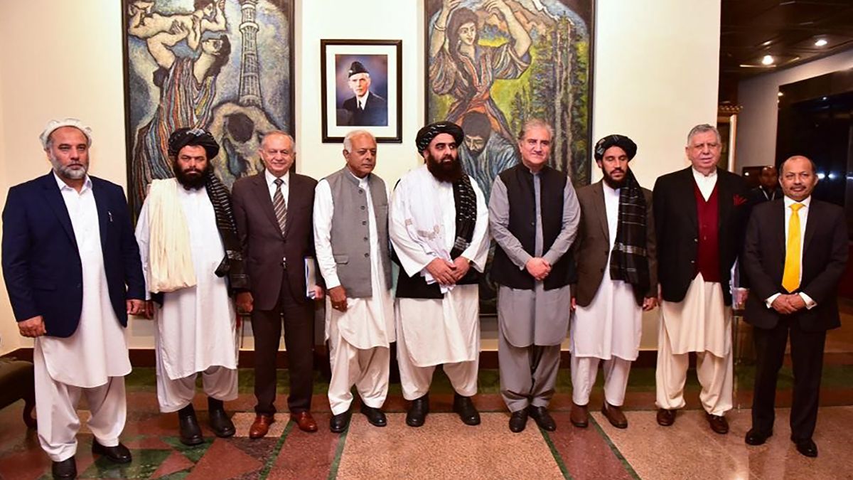 This handout photograph taken and released by Pakistan's Ministry of Foreign Affairs on November 11, 2021, shows Afghanistan's acting Foreign Minister Amir Khan Muttaqi (C), Pakistan's Foreign Minister Shah Mahmood Qureshi (4R), Pakistan Minister for Aviation Ghulam Sarwar Khan (4L), Pakistan's Prime Minister commerce adviser Abdul Razak Dawood (3L) pose for picture along with other delegation members at Pakistan's Foreign Ministry, in Islamabad. AFP Afghanistan, Pakistan extend ceasefire in Istanbul talks