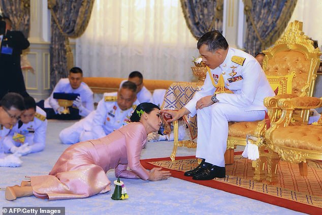 15035030-8296531-Thailand_s_King_Maha_Vajiralongkorn_and_Queen_Suthida_during_the-a-1_1588871748049.jpg