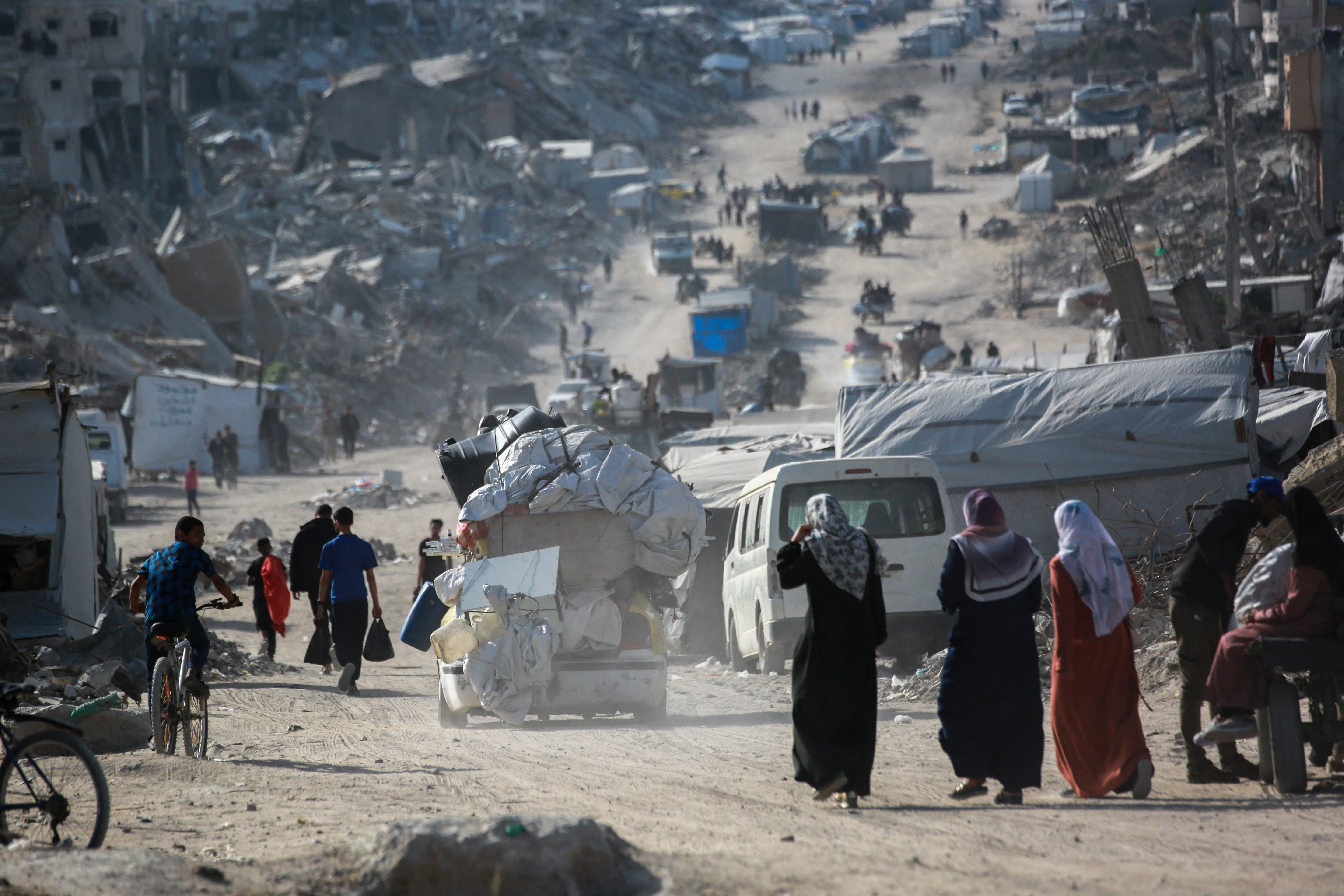 Death and destruction in Gaza as Israel targets residential areas and aid teams