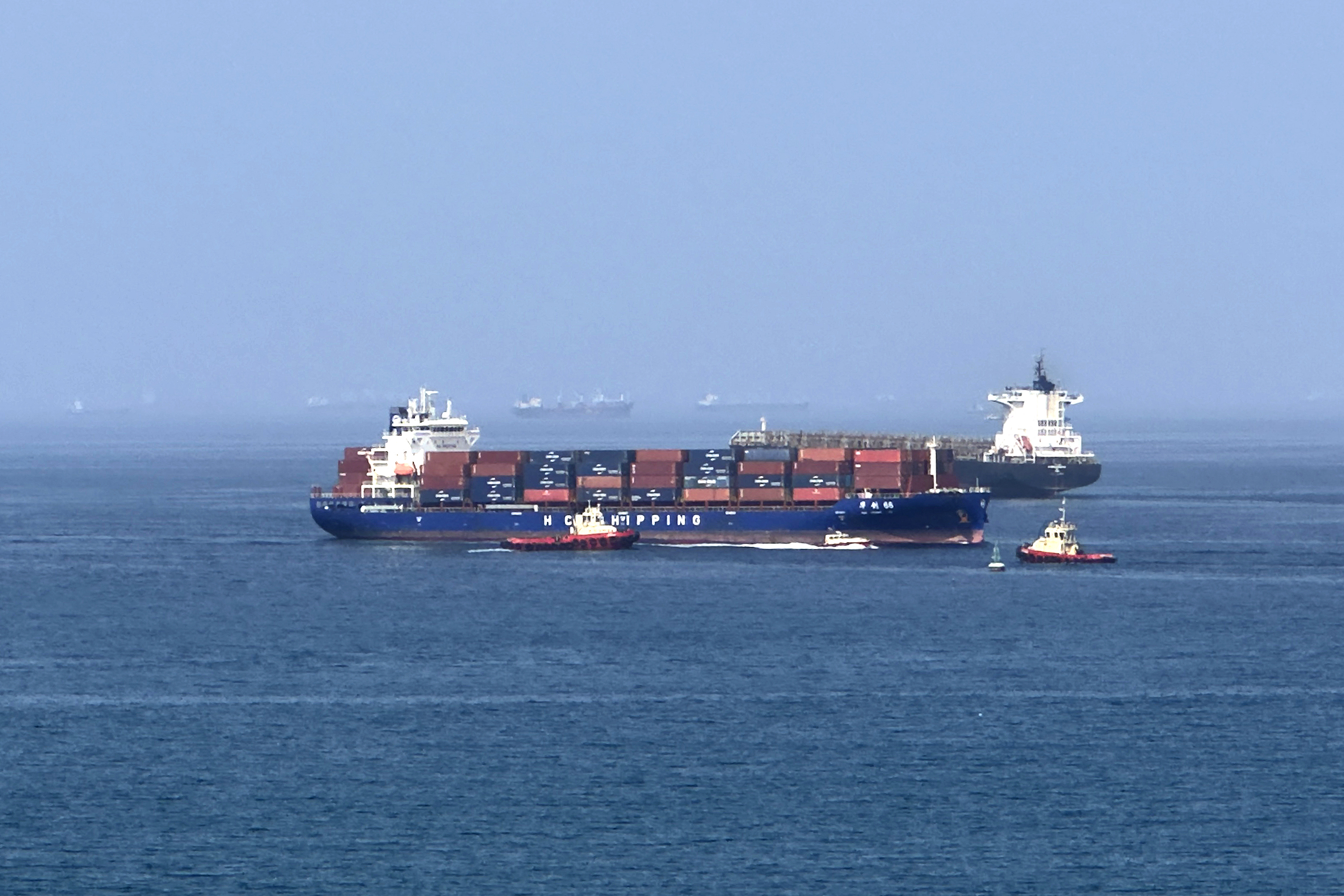 Foreign cargo ship runs aground in Strait of Hormuz as Iran defends shipping controls