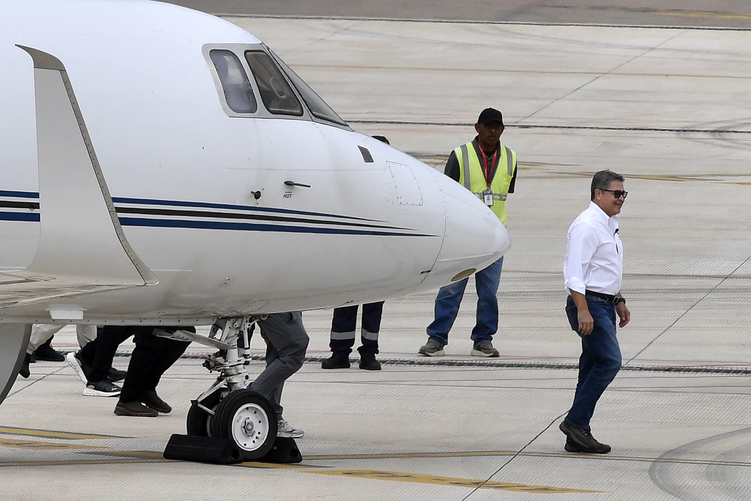 Former Honduran president Hernández returns home after Trump pardon