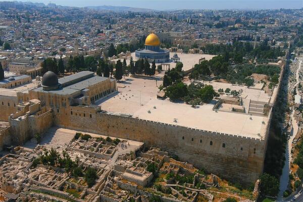 Ancient Old city dome of the rock mosque, aerial view Beautiful drone shot from Old city of Jerusalem al Aqsa Mosque, June, 2022. Shutterstock image.