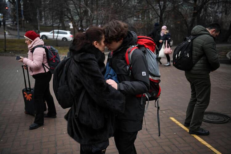 In Pictures: Ukrainians Flee, Take Shelter After Invasion 