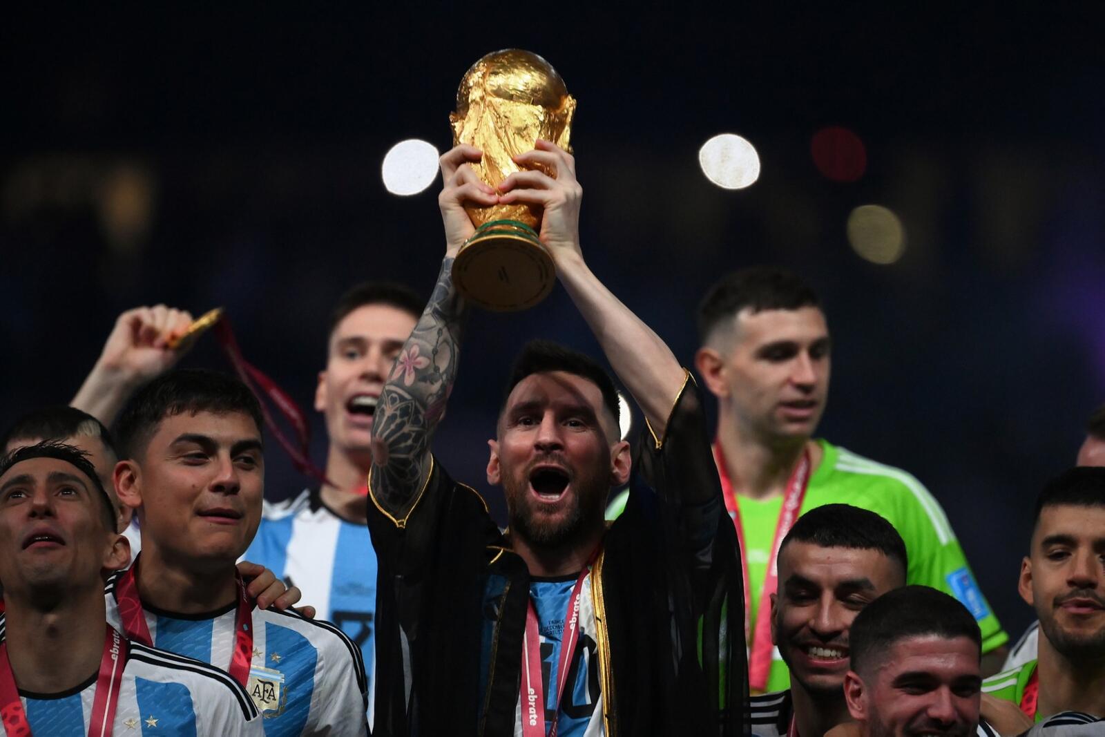 Argentina's forward #10 Lionel Messi lifts the World Cup trophy during the Qatar 2022 World Cup trophy ceremony after the football final match between Argentina and France at Lusail Stadium in Lusail, north of Doha on December 18, 2022. - Argentina won in the penalty shoot-out. (Photo by FRANCK FIFE / AFP)