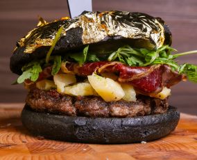 Artisanal black sandwich filled with meat burgers