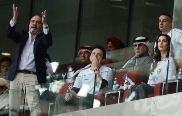 Jordanian crown prince Hussein and his uncle Prince Ali watching Jordan's football team play
