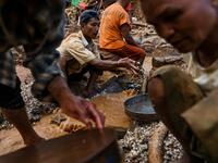 This photo taken on May 16, 2019 shows miners panning for rubies and other gemstones in a ruby mine in Mogok, north of Mandalay. Burrowing deep underground, thousands of informal miners risk their lives to find gleaming red gems as a law change spurs opportunity in Myanmar's "land of rubies". Ye Aung THU / AFP