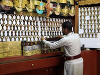 A Yemeni vendor displays "janbiyas", traditionally-worn short curved daggers, in Sanaa on May 28, 2019 during the holy Muslim month of Ramadan and ahead of Eid al-Fitr celebrations.  Mohammed HUWAIS / AFP