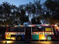 A picture taken late on June 7, 2019 shows "The Bus Cafe Erbil" in Arbil, the capital of Iraq's Kurdish autonomous region, on the long weekend of the Eid al-Fitr holiday which marks the end of the Muslim holy month of Ramadan.  SAFIN HAMED / AFP