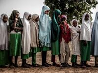 A group of Fulani students queue at the school grounds before the beginning of the day's lessons at Wuro Fulbe Nomadic School in Kacha Grazing Reserve for Fulani people, Kaduna State, Nigeria, on April 19, 2019. Luis TATO / AFP