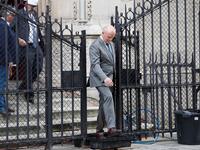 French Army General Jean-Louis Georgelin, in charge of Notre-Dame Cathedral's reconstruction (R) leaves after taking part in the first mass of cathedral on June 15, 2019, in Paris, two months after the April 15 devastating fire. Zakaria ABDELKAFI / AFP