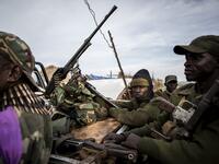 Soldiers of the Armed Forces of the Democratic Republic of the Congo (FARDC) sit in a truck bed in a base on July 3, 2019 in Djugu, eastern DR Congo. John WESSELS / AFP