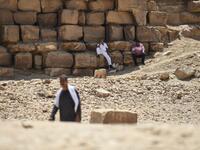 An Egyptian archaeological mission discovered a collection of stone, clay and wooden sarcophagi, of which some are still containing well preserved mummies, as well as a collection of wooden funerary masks and instruments used in cutting stones .  Mohamed el-Shahed / AFP