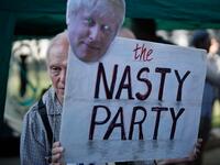 Demonstrators against Conservative Party leadership candidate Boris Johnson gather outside Downing Street with placards in central London on July 22, 2019 the eve of the announcement of the winner of the Tory leadership contest and who will become Britain's new prime minister.  Tolga Akmen / AFP
