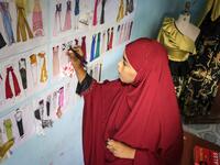 Somalia's clothes business is a simple one: foreign imported garments for the well-to-do, locally tailored clothes for the rest. But new fashion designers are complicating that picture with locally-designed, hand-made attire. Abdi HAJJI HUSSEIN / AFP