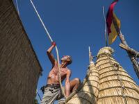 A member of the crew assembles the 14-meter long sailing reed boat Abora IV in the town of Beloslav, Bulgaria, on July 25, 2019. A team of two dozen researchers and volunteers from eight countries are preparing to set out in mid-August on a 1,300 kilometres (700 nautical mailes or 800 miles) journey to test the hypothesis that prehistoric trade routes traversed the high seas. NIKOLAY DOYCHINOV / AFP