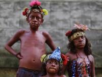Catholic faithful children smeared in floor painture take part in the opening of the ten-day celebration of the Santo Domingo de Guzman festival in Managua, on August 1, 2019.  INTI OCON / AFP