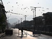A security personnel stands guard at a roadblock during a curfew in Srinagar on August 6, 2019. India's home affairs minister on August 6 hailed "historic" legislation to bring Kashmir under its direct control, as New Delhi stepped up its clampdown on dissent in the restive Muslim-majority region. Tauseef MUSTAFA / AFP