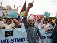 Students of Islami Jamiat-e-Talaba (IJT), a wing of religious political party Pakistan Jamaat-e-Islami (JI), burn a photograph of Indian Prime Minister Narendra Modi during a protest in Peshawar  ABDUL MAJEED / AFP