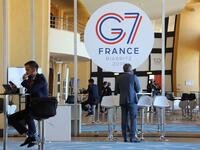 People work in the advanced press centre in the Casino of Biarritz, south-west France on August 24, 2019. ludovic MARIN / AFP
