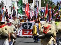 Demonstrators wear a traditional Basque shepherd costume, during a march in Hendaye, south-west France on August 24, 2019, against the annual G7 Summit. GEORGES GOBET / AFP