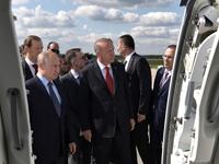 Russian President Vladimir Putin (L) shakes hands with his Turkish counterpart Recep Tayyip Erdogan visit the MAKS-2019 International Aviation and Space Salon opening day in Zhukovsky outside Moscow on August 27, 2019.  Alexey NIKOLSKY / SPUTNIK / AFP
