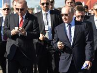 Russian President Vladimir Putin (R) and his Turkish counterpart Recep Tayyip Erdogan eat loacally made ice cream as they visit the MAKS-2019 International Aviation and Space Salon opening day in Zhukovsky outside Moscow on August 27, 2019.  Alexey NIKOLSKY / SPUTNIK / AFP