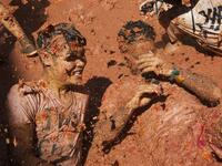 A reveller covered in tomato pulp participates in the annual "Tomatina" festival in the eastern town of Bunol, on August 28, 2019. JAIME REINA / AFP