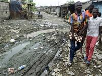 While dozens of matches are played simultaneously, participants, some as young as three years old, practice this brain game often considered out of reach for the poor populations of Africa's most populous country. PIUS UTOMI EKPEI / AFP