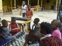 Young saxophonist Temilayo Abodurin (L) and pianist Joshua Akinotan play to motivate fellow children during a chess class at Ogolonto in Ikorodu district of Lagos, on August 17, 2019.  PIUS UTOMI EKPEI / AFP