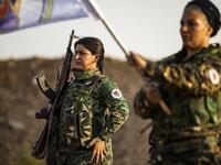 Members of the Bethnahrin Women Protection Forces (HSNB), an all-female Syriac-Assyrian paramilitary group under the umbrella of the Syrian Democratic Forces (SDF), line-up as they commemorate the fourth anniversary of their creation, in the countryside of the town of Tall Tamr in the northwestern Syrian province of Hasakah, on August 30, 2019.  Delil SOULEIMAN / AFP