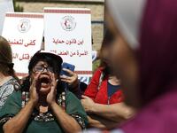 Palestinian women protest in support of women’s rights outside the prime minister’s office in the West Bank city of Ramallah on September 2, 2019, after a young Palestinian died in a case that has raised emotions.  ABBAS MOMANI / AFP