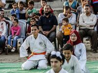 Young Palestinian karatekas attend a Karate promotion ceremony at a sporting centre in the Rafah camp for Palestinian refugees in the southern Gaza Strip on September 20, 2019. SAID KHATIB / AFP