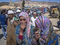 Amazigh (Berber) men and women take part in the annual "Engagement Moussem" festival near the village of Imilchil in central Morocco's high Atlas Mountains on September 21, 2019. Each year in the High Atlas Mountains hamlet of Ait Amer, tribes celebrate with dances and music, the collective wedding of young Amazigh couples during the traditional festival of "Engagement Moussem". FADEL SENNA / AFP