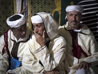 Members of a traditional music group gather before performing at the annual "Engagement Moussem" festival near the village of Imilchil in central Morocco's high Atlas Mountains on September 21, 2019. Each year in the High Atlas Mountains hamlet of Ait Amer, tribes celebrate with dances and music, the collective wedding of young Amazigh couples during the traditional festival of "Engagement Moussem". FADEL SENNA / AFP