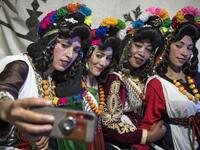 Young Amazigh (Berber) women pose for a selfie photograph during the annual "Engagement Moussem" festival near the village of Imilchil in central Morocco's high Atlas Mountains on September 21, 2019. Each year in the High Atlas Mountains hamlet of Ait Amer, tribes celebrate with dances and music, the collective wedding of young Amazigh couples during the traditional festival of "Engagement Moussem". FADEL SENNA / AFP