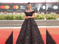 Saudi actress Mila Al Zahrani sported a black gown with feathers for her first look