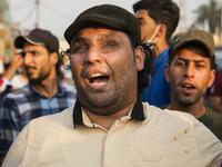 An Iraqi protestor wounded in war shouts slogans during a demonstration against state corruption, failing public services and unemployment, on October 2, 2019 in the southern city of Basra. Popular protests multiplied across Iraq today as thousands of demonstrators braved live fire and tear gas in rallies that have left seven dead in the past 24 hours. Hussein FALEH / AFP