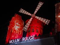 This picture taken on October 6, 2019 shows Moulin Rouge logo during the celebration of the 130th anniversary of the French oldest cabaret, in Paris.  GEOFFROY VAN DER HASSELT / AFP