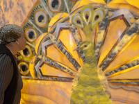A woman kisses an image of the Melek Taus, or the Peacock Angel, in the new Yazidi Temple in the village of Aknalich, 35 kilometres from the Armenian capital Yerevan,  KAREN MINASYAN / AFP