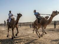 Palestinian jockeys compete during a local camel race held at the destroyed Gaza airport, in Rafah in the southern Gaza Strip on October 20, 2019. SAID KHATIB / AFP
