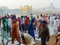 Sikh devotees visit the Golden Temple to mark Bandi Chhor Divas which coincides with the day of Diwali in Amritsar on October 27, 2019. Sikhs celebrate Bandi Chhor Divas on the same day as the Hindu festival of Diwali, to mark the historic return of the sixth Guru Hargobind. NARINDER NANU / AFP