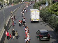 Lebanese protesters hold hands to form a human chain along the coast from north to south as a symbol of unity during ongoing anti-government demonstrations on Jounieh highway north of Lebanon's capital Beirut on October 27, 2019. JOSEPH EID / AFP