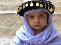 Photo of little Yezidi child in Yezidi traditional clothes in Lalish Temple the holiest Yezidi Religious Site in the world (Twitter)