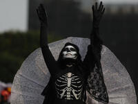 A costumed participant walks in the annual International Day of the Dead Parade in Mexico City  Emilio Espejel / Anadolu Agency / Getty