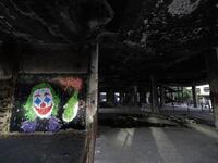 A graffiti by street artist Ashekman is sprayed inside "the Egg" building in Lebanon's capital Beirut on November 11, 2019. Since October 17, the chanting of tens of thousands of Lebanese denouncing the political elite have shaken the normally staid district around two Beirut squares, Martyrs' and Riad Al Solh. JOSEPH EID / AFP