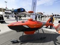 This picture taken on November 18, 2019 shows a view of a Russian Helicopters VRT 300 twin coaxial rotor unmanned helicopter on display during the 2019 Dubai Airshow. KARIM SAHIB / AFP