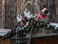 A worker installs the traditional Christmas market in Strasbourg, eastern France, on November 18, 2019, one year after the deadly attack, as the Christmas market of the city will open on November 22. PATRICK HERTZOG / AFP